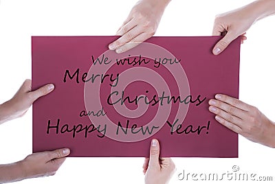 Hands Holding Sign with Christmas Greetings Stock Photo