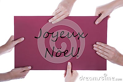 Hands Holding Sign Joyeux Noel Stock Photo