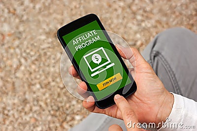 Hands holding smart phone with affiliate program concept on scre Stock Photo