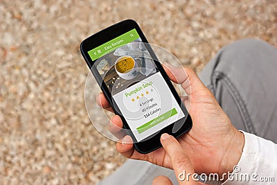 Hands holding smartphone with food application mock up on screen Stock Photo