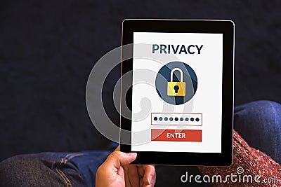 Hands holding tablet computer with online privacy concept on screen Stock Photo