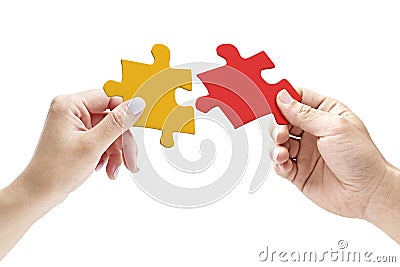 Hands holding two matching jigsaw pieces Stock Photo