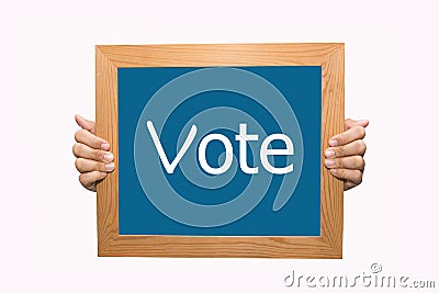 Hands Holding a Vote Sign Stock Photo