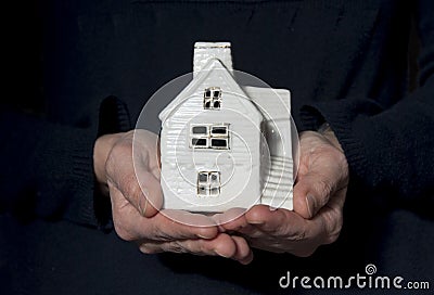 Hands with house model Stock Photo