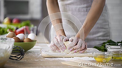 Hands of housewife kneading the dough at home, method of preparing biscuits Stock Photo