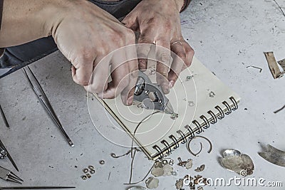 Hands of a Jeweler Stock Photo