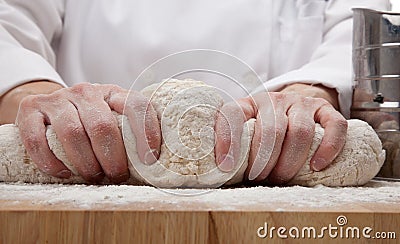 Hands kneading bread dough Stock Photo