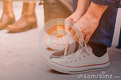 Hands are laced sneakers. Stock Photo