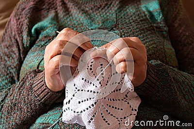 Hands of a lady doing crochet Stock Photo