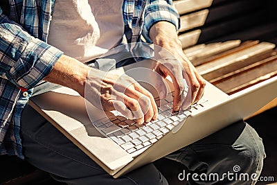 Hands on laptop Stock Photo