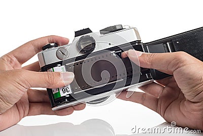 Hands loading film into camera Stock Photo