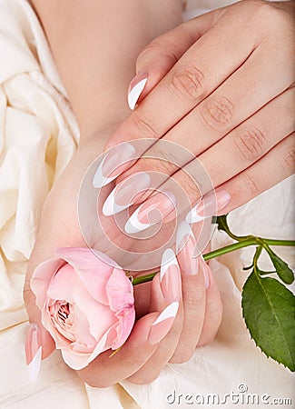 Hands with long artificial french manicured nails Stock Photo