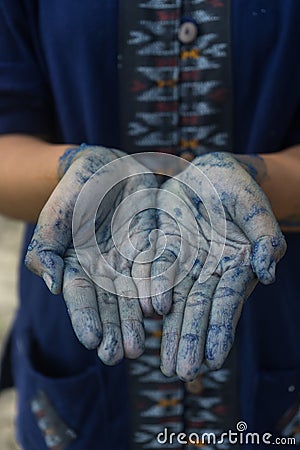 Hands made Process dye fabric indigo color in Phare Thailand. Stock Photo