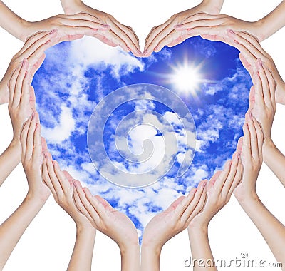 Hands make heart shape on blue sky Stock Photo