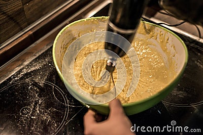 Hands making duff pastry egg in bowl to make fresh waffles Stock Photo