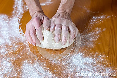 Hands of a male baker making bread Stock Photo
