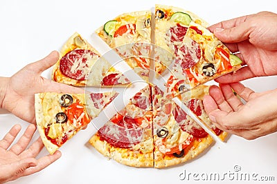 Hands of a man and a child snapping up pieces of tasty pizza Stock Photo