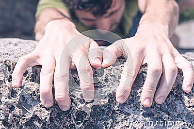 Hands of Man Climbing Stock Photo