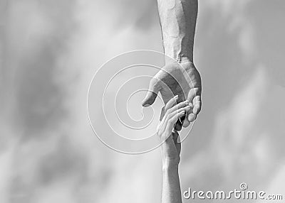 Hands of man and woman on blue sky background. Lending a helping hand. Hands of man and woman reaching to each other Stock Photo