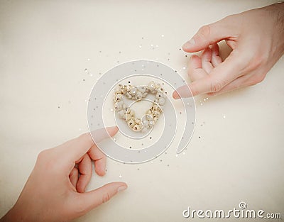 Hands of man and woman connected through a heart. Invitation card. Stock Photo