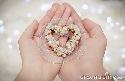 Hands of man and woman connected through a heart. Invitation card. Stock Photo