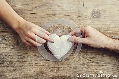 Hands of man and woman connected through a heart. Stock Photo