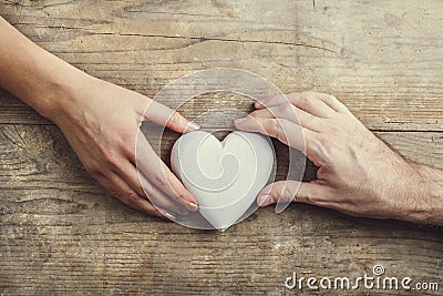 Hands of man and woman connected through a heart. Stock Photo