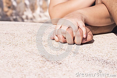 Hands of man and woman intertwined Stock Photo