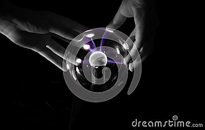 Hands manipulating a crystal ball Stock Photo