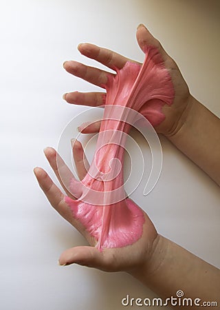 Hands Manipulating Pink Slime Stock Photo