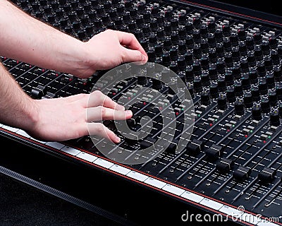 Hands on Mixing Console Stock Photo