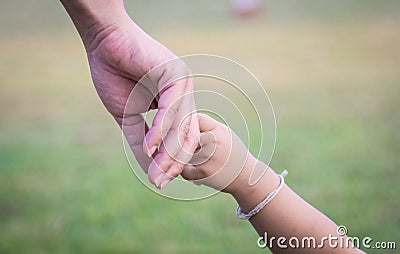 Hands of mother and child Stock Photo