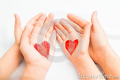 Hands of mother and child Stock Photo