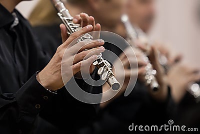 Hands musician playing the flute Stock Photo