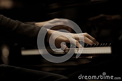 Hands musician playing the piano Stock Photo