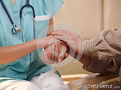 Hands of nurse and elderly patient. Stock Photo