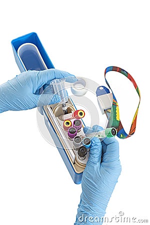 Hands of nurse organising her bloods test tubes box for laboratory Stock Photo