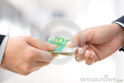 Hands passing money - Euro (EUR) bills Stock Photo