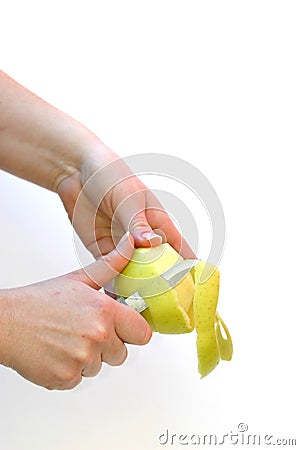 Hands peeling an apple Stock Photo