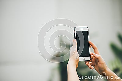 Hands and phones Communication tools of the modern online world. Stock Photo