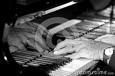 Hands on piano Stock Photo