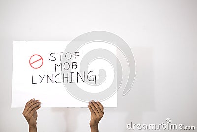 Hands with Placard showing of Stop Mob Lynching on isolated background Stock Photo