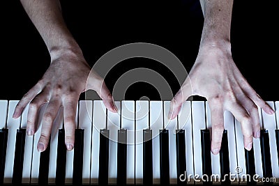 Hands play the piano. Stock Photo