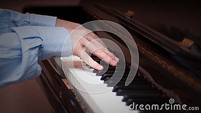 Hands playing on a piano Stock Photo
