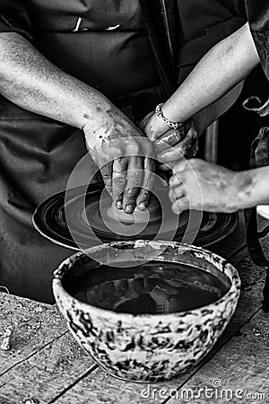 Hands of a potter forming clay Stock Photo