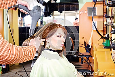 Hands of professional hairdresser Stock Photo