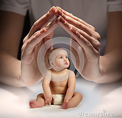 hands protect the child Stock Photo