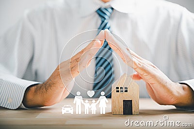 Hands with protective gesture and family Stock Photo