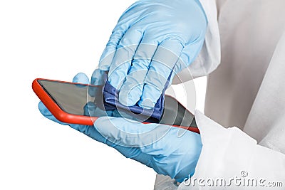 Hands in protective gloves cleaning phone from dust and infection Stock Photo