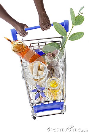 Hands pushing supermarket trolleys filled with pills Stock Photo